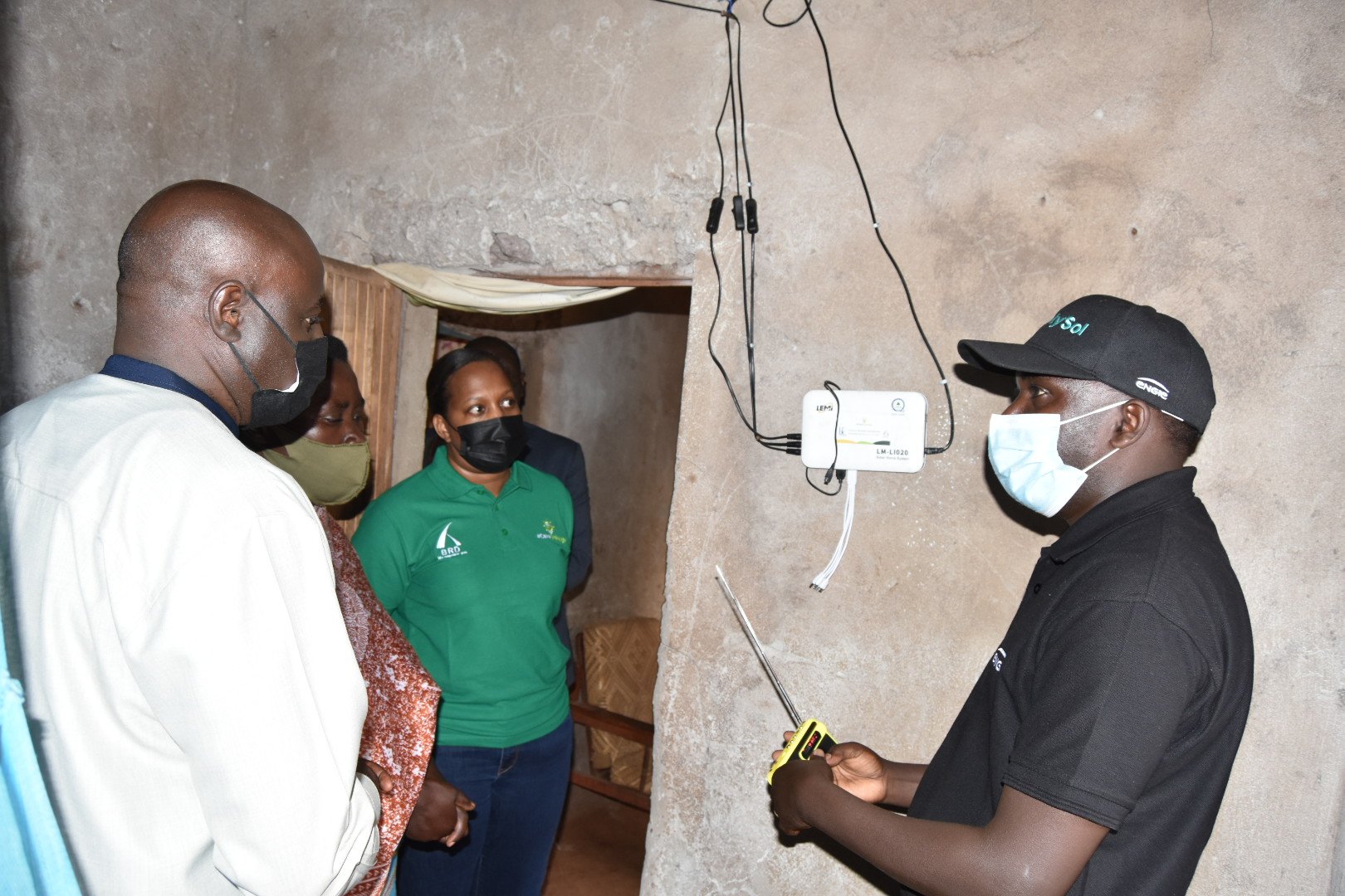 Officials tour inside a residential house of beneficiary of Cana Challenge. Photo: Courtesy.