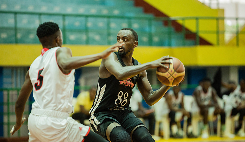 Patriots' Aristide Mugabe with the ball during a past  game against IPRC Musanze. / Dan Nsengiyumva