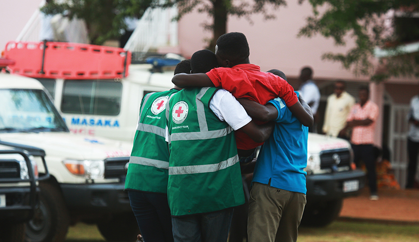Red Cross volunteers help a trauma victim at Kicukiro Nyanza Genocide Memorial on May 4, 2019 . Photo by / Sam Ngendahimana