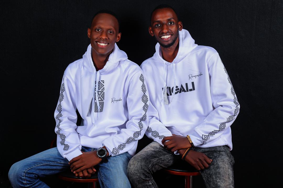 Kelly Gahunga (left) with a friend in Rwagasabo hoodies. 