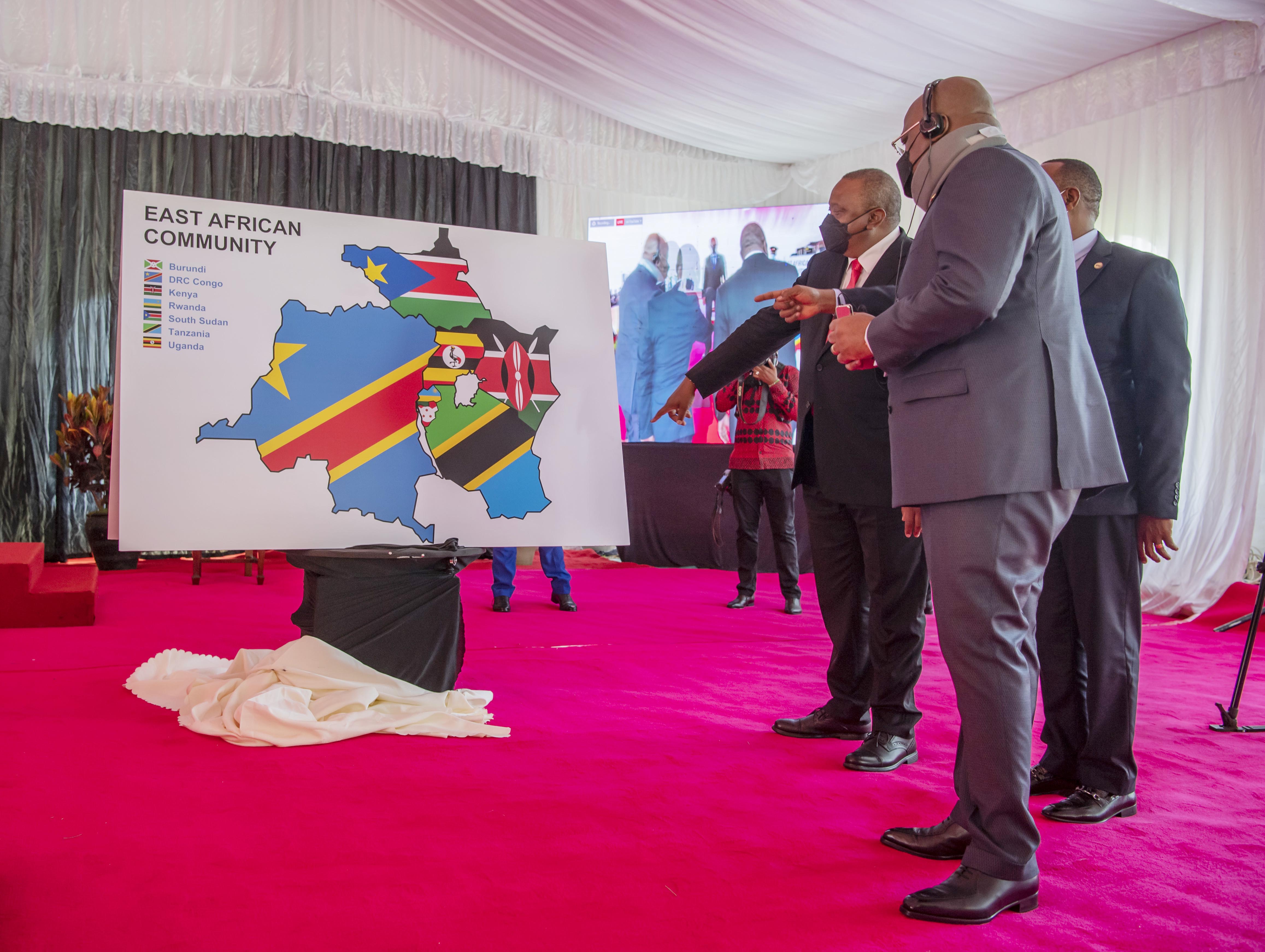 The Kenyan President Uhuru Kenyatta and DRC President Fu00e9lix Tshisekedi unveil the new map of East African Community during the Signing Ceremony of the Treaty of Accession by DRC to the East African Community. 
