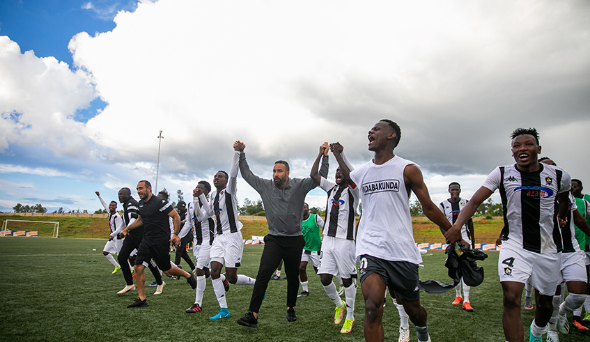 APR head coach Mohamed Adil Errade with his players celebrate a crucial win over Bugesera on Sunday at Bugesera Stadium. / Olivier Mugwiza