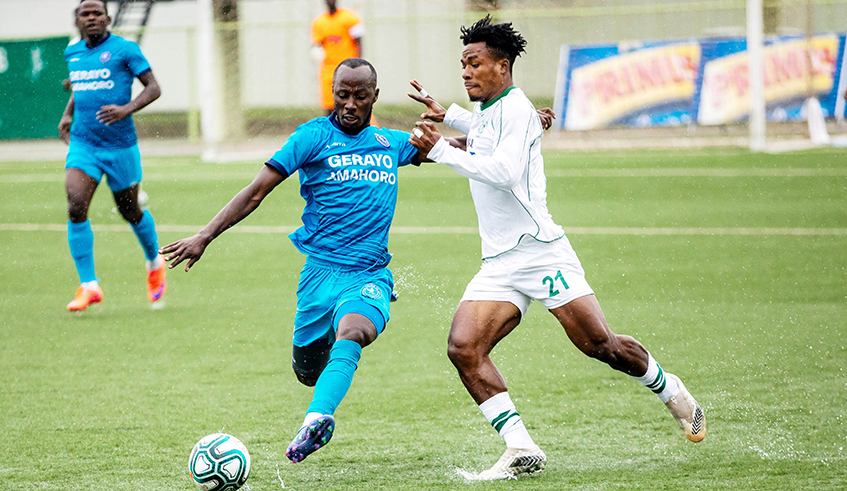 Police FC midfielder Eric Nsabimana controls the ball against Sc Kiyovu players during the league match at Kigali Stadium./ Olivier Mugwiza