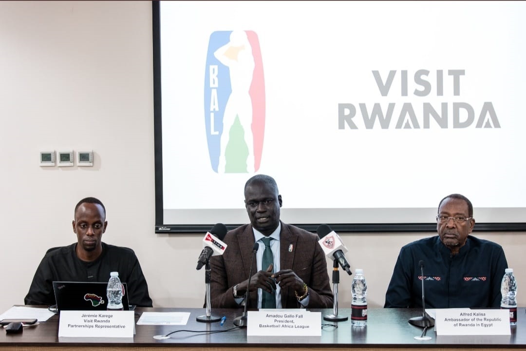Amadou Gallo Fall, the president of Baskeball Africa League, flanked by Rwandau2019s Ambassador to Egypt, Albert Kalisa and Visit Rwanda partnership representative Jeremie Karege during a presser to announce Kigaliu2019s readiness to host BAL finals. / Photo: Courtesy.