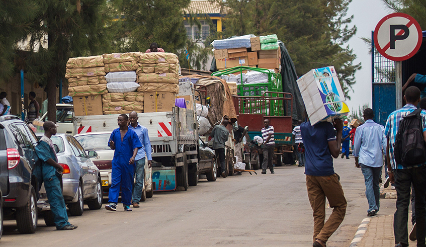 Workers in Kigaliu2019s Central Business District load cargo on upcountry bound trucks. Rwandau2019s consumer prices continued to rise in the past months, driving up year-on-year inflation rate for March to 7.5 per cent, up from 5.8 per cent in February 2022. / Photo: Sam Ngendahima.