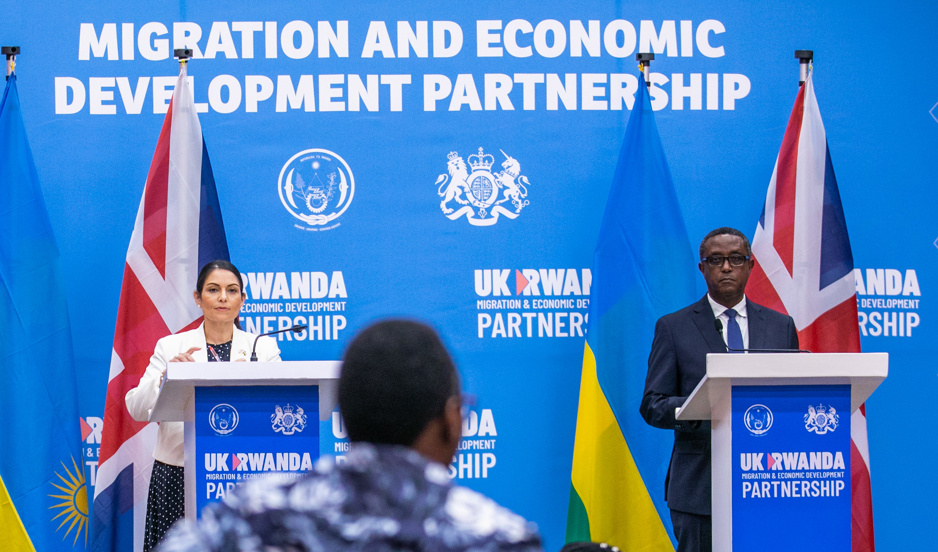 Rwandau2019s Minister for Foreign Affairs and International Cooperation Dr Vincent Biruta and the United Kingdomu2019s Home Secretary Priti Patel address the media after signing the five-year deal on relocation of migrants and asylum seekers in Kigali on April 14. / Photo by Olivier Mugwiza  