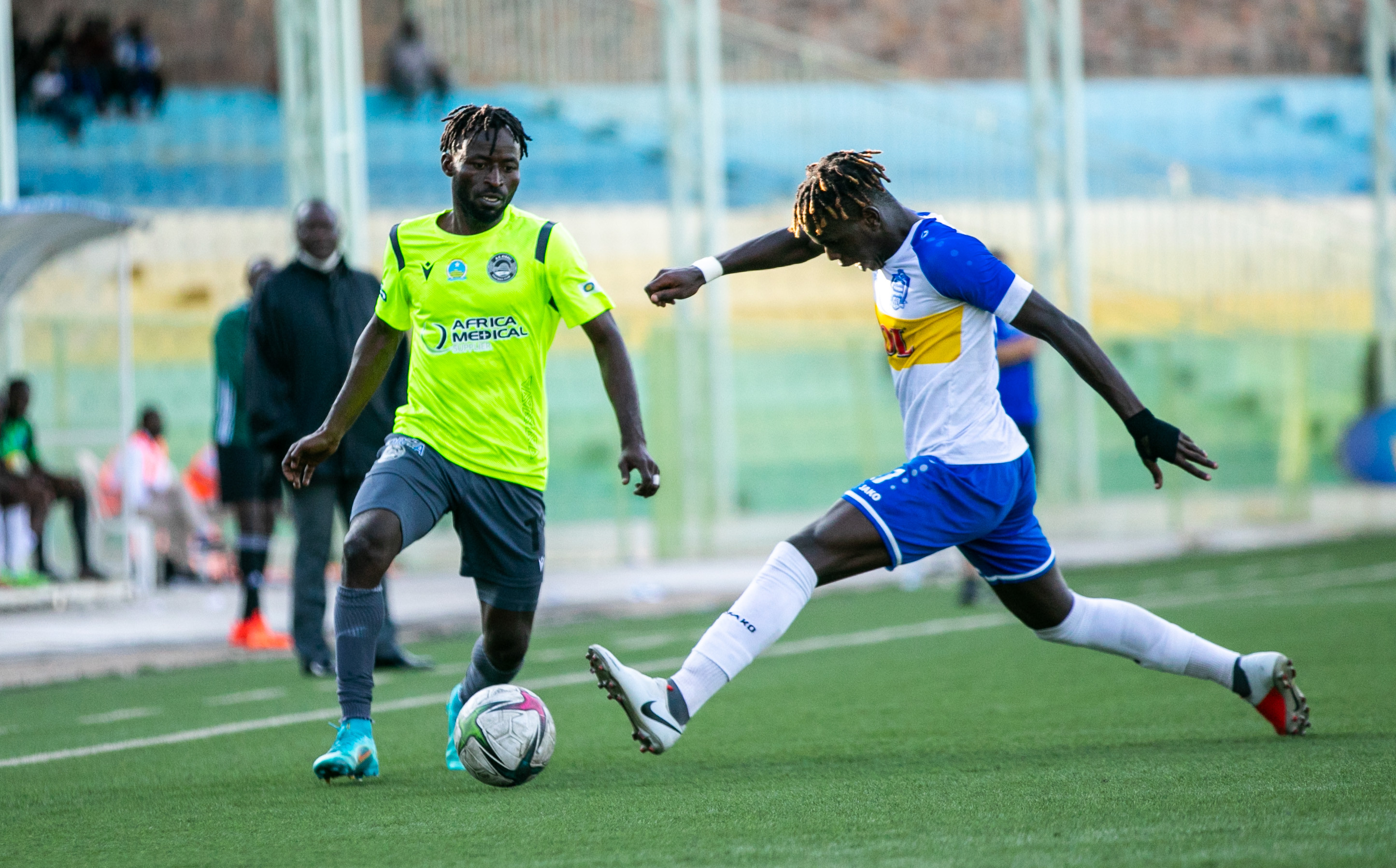 AS Kigali striker Shaban Husein Shabalala controls the ball try to go past Rayon sports defender at Kigali Stadium on April 23. 