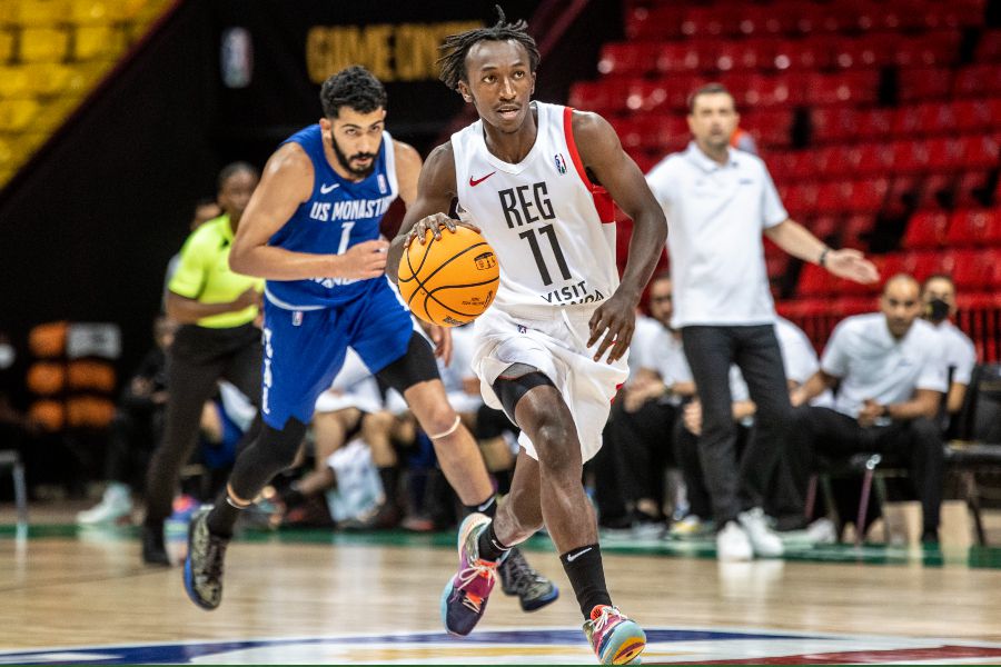REG' s Nshobozwabyosenumukiza with the ball during the game in Senegal.Starting on Monday, April 25,REG will start a residential training camp to gear up for the playoffs of the Basketball Africa League (BAL) 2022 that will take place from May 21-28 in Kigali. Courtesy