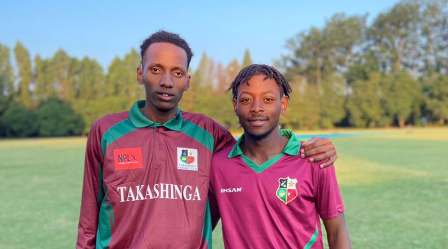Cricketer Orchide Tuyisenge (L) poses for a photo with his new teammate shortly after joining Zimbabweu2019s Takashinga Patriote Cricket Club. 