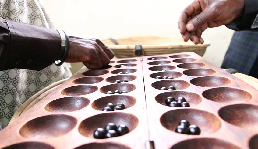 Igisoro, a popular board game in African culture that is also wellknown in the ancient Rwanda . File 