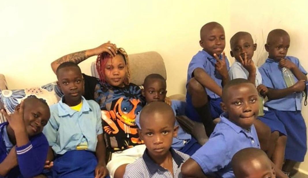 The DJ with some of the kids who attend school in Kigali. /  Photos: Courtesy