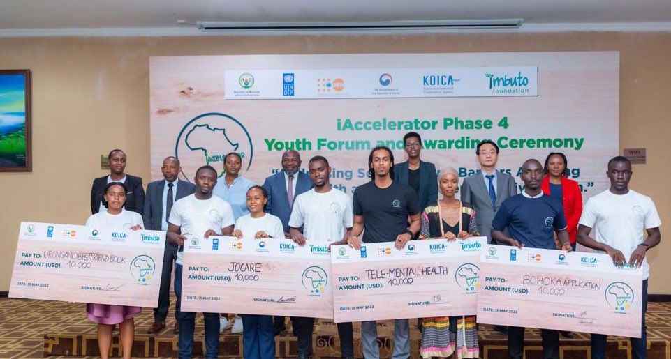 Officials pose for a group photo with four young innovators who won a grand prize of 10,000 USD each after pitching innovative ideas that promote sexual reproductive health and mental health on Friday ,May 13. Courtesy