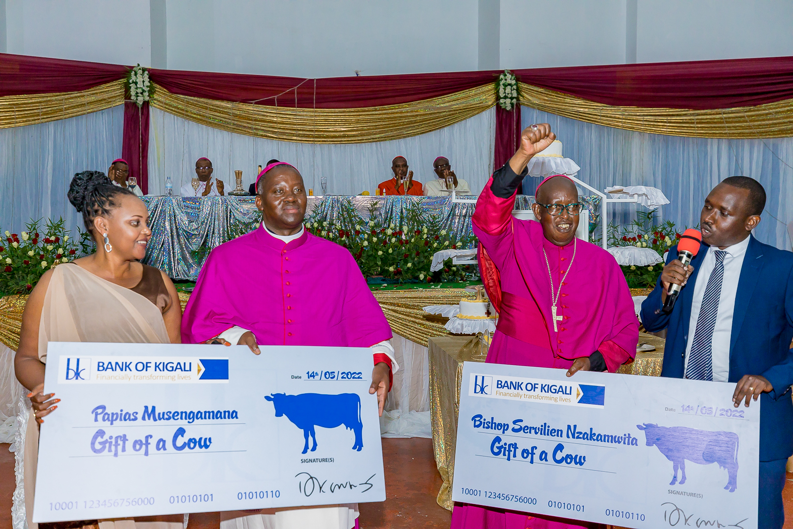 Bank of Kigali Group Plc (BK) has gifted cows to the former Bishop of Byumba Catholic Diocese, Servilien Nzakamwita and the newly consecrated Bishop Papias Musengamana as the symbol of the partnership between BK and Diocese.