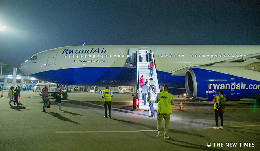 Travellers board Rwandairu2019s plane at Kigali International Airport. Photo: File.