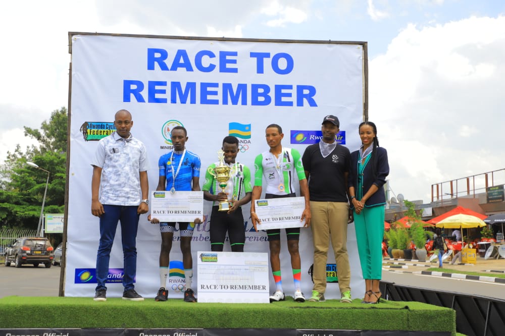 A group photo of the officials and the winners in elites categories .Moise Mugisha (C) the winner of Race to Remember and Samuel Niyonkuru of Adrien Niyonshuti Cycling Academy the  second and the Eritrean  Mehari Tewelde Berhe,,the third during the awarding ceremony on May 22. Courtesy