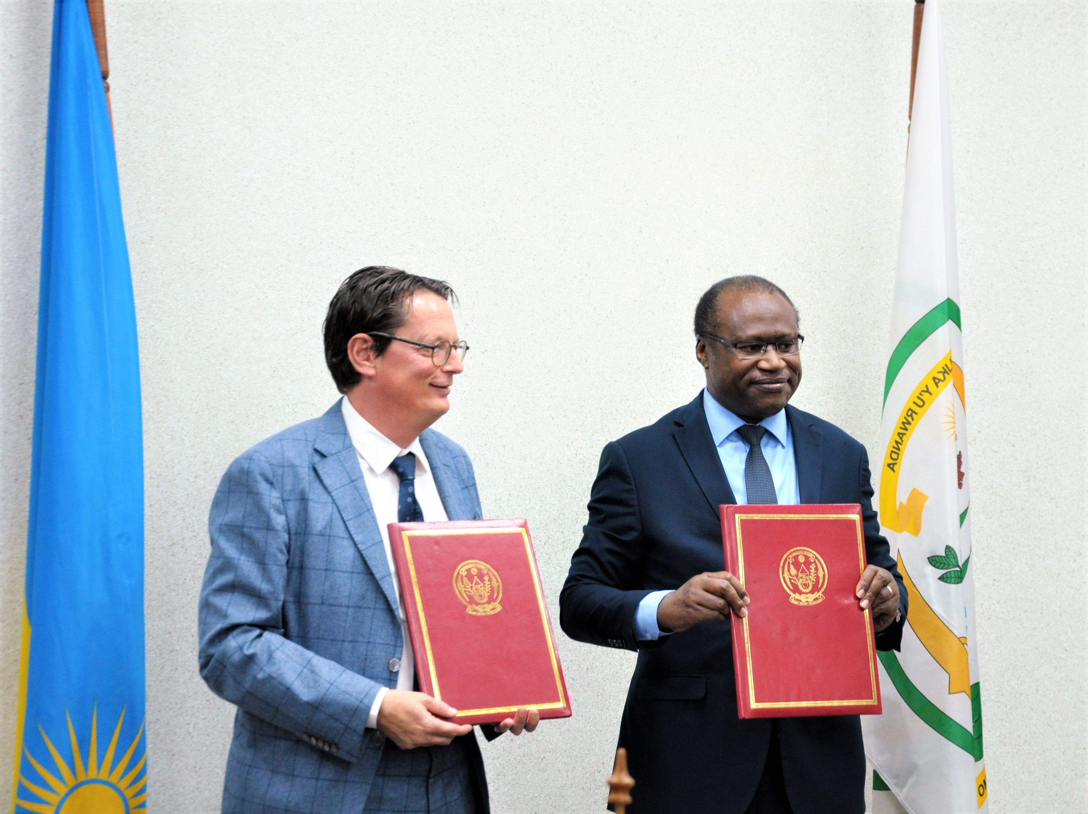 Minister of Finance and Economic Planning, Uzziel Ndagijimana and Bert Versmessen, Ambassador of the Kingdom of Belgium to Rwanda after signing of the MoU in Kigali on Friday, May 20. 