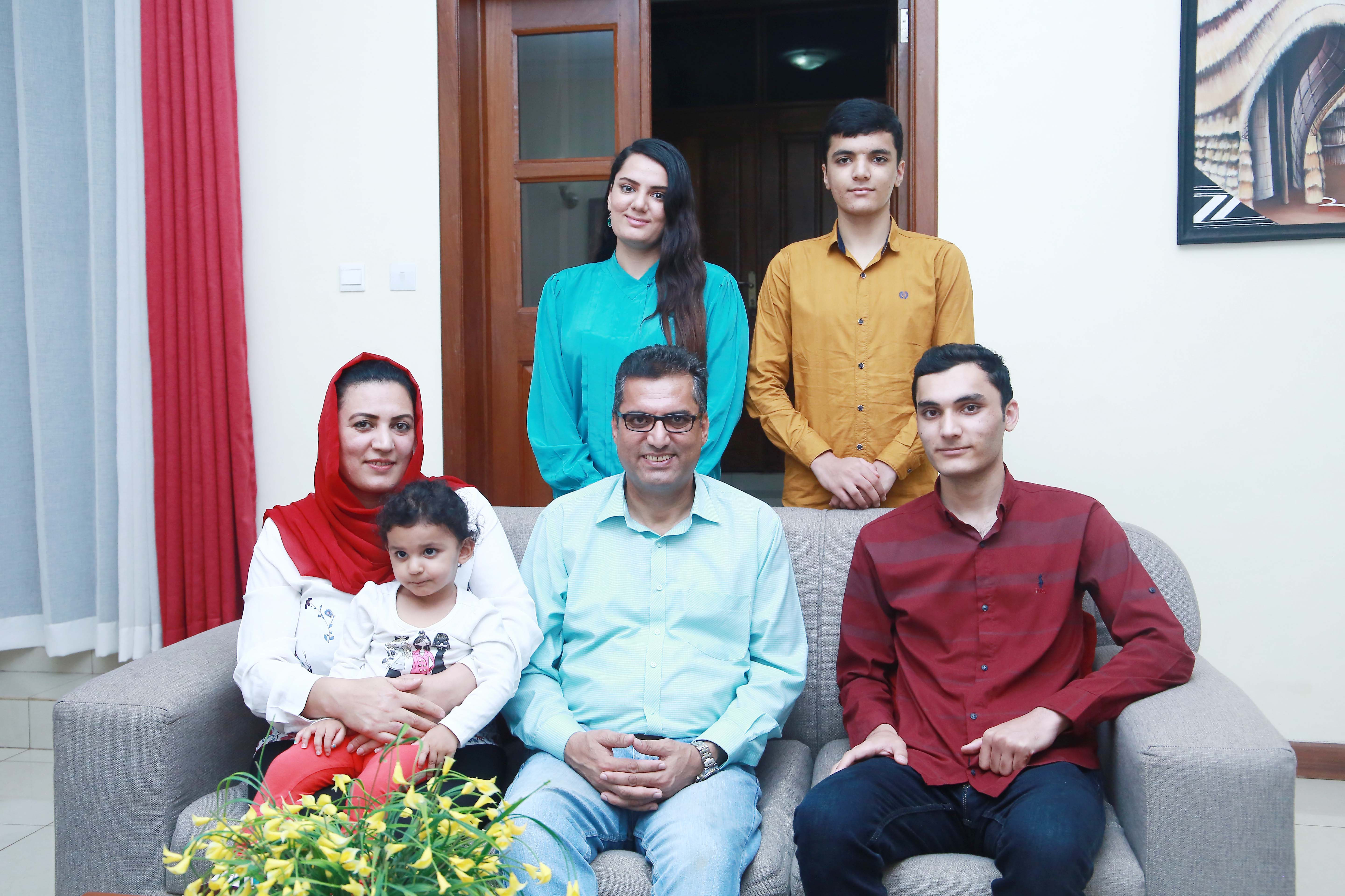 Dr Nesar Ahmed Hamraz (seated, centre) with his wife, Dr Melinda Hamraz, and their children pose for a family photo after an interview in Kigali on May 9. Sam Ngendahimana.