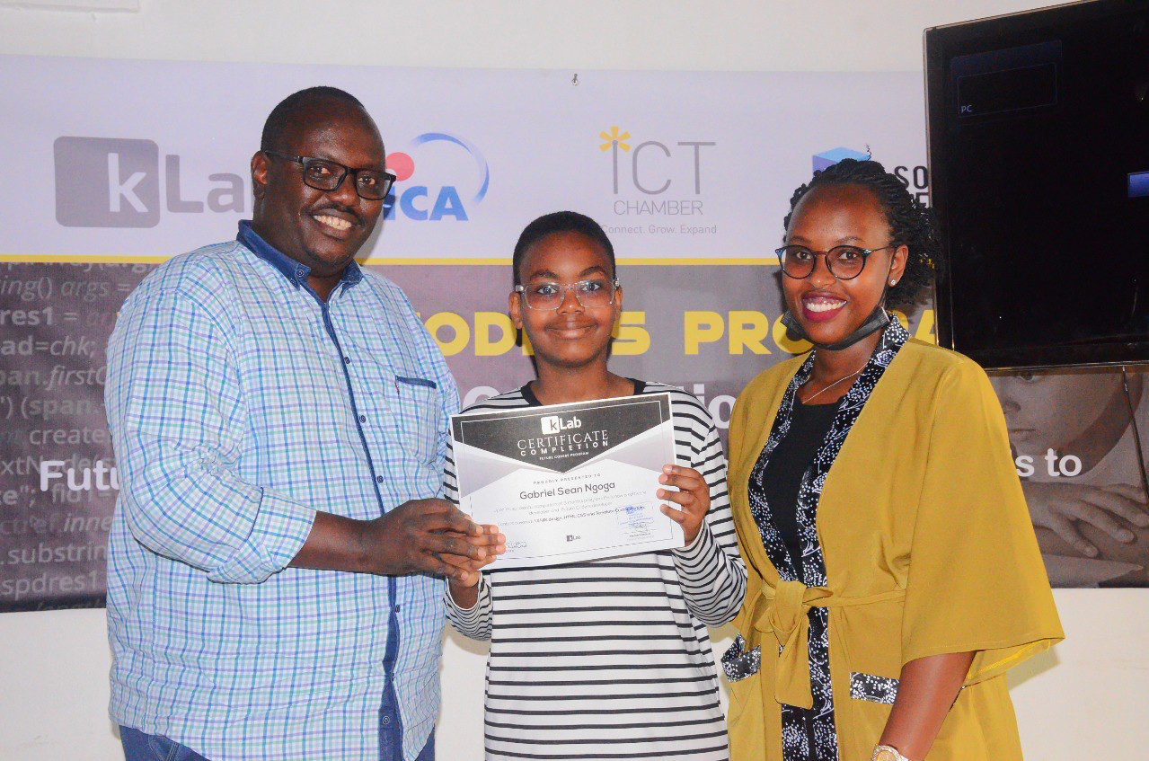 Gabriel Sean Ngoga receives the certificate for completing Future Coders program in Kigali