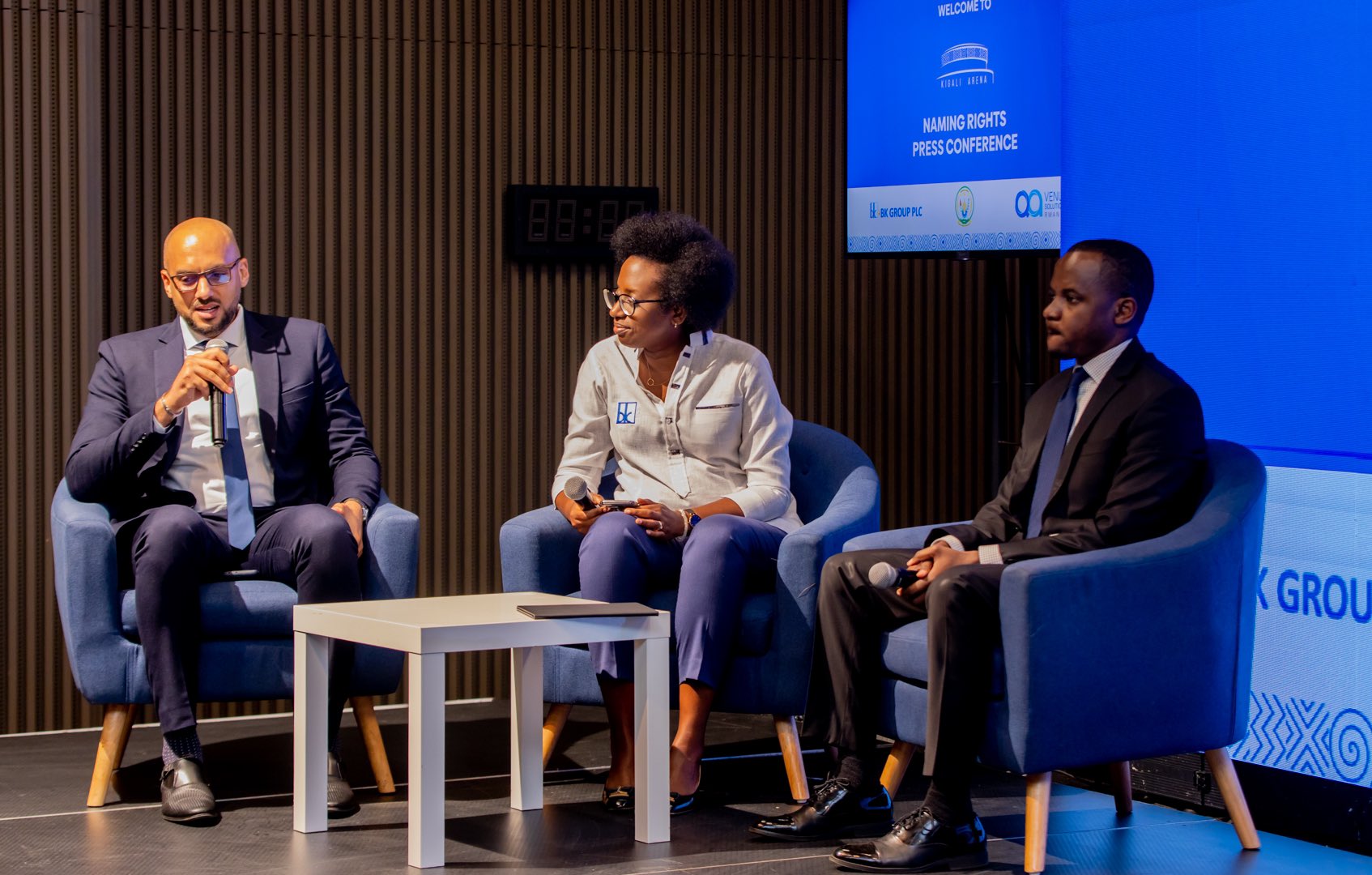 BK Chief Executive Diane Karusisi, (M) QA Solutions Director Kyle Schofield (R) and RDB Deputy CEO Zephanie Niyonkuru during the official launch of the deal in Kigali on May 24. Courtesy