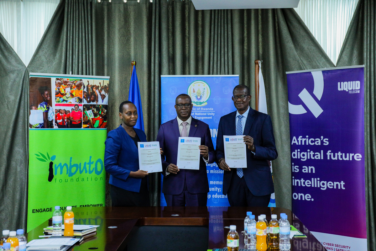(L-R) Geraldine Umutesi, the Deputy Director General of the Imbuto Foundation, Jean-Damascu00e8ne Bizimana, the Minister for National Unity and Civic Engagement, and Sam Nkusi, the Chairman of Liquid Telecom East Africa during signing ceremony on May 25, 2022. 