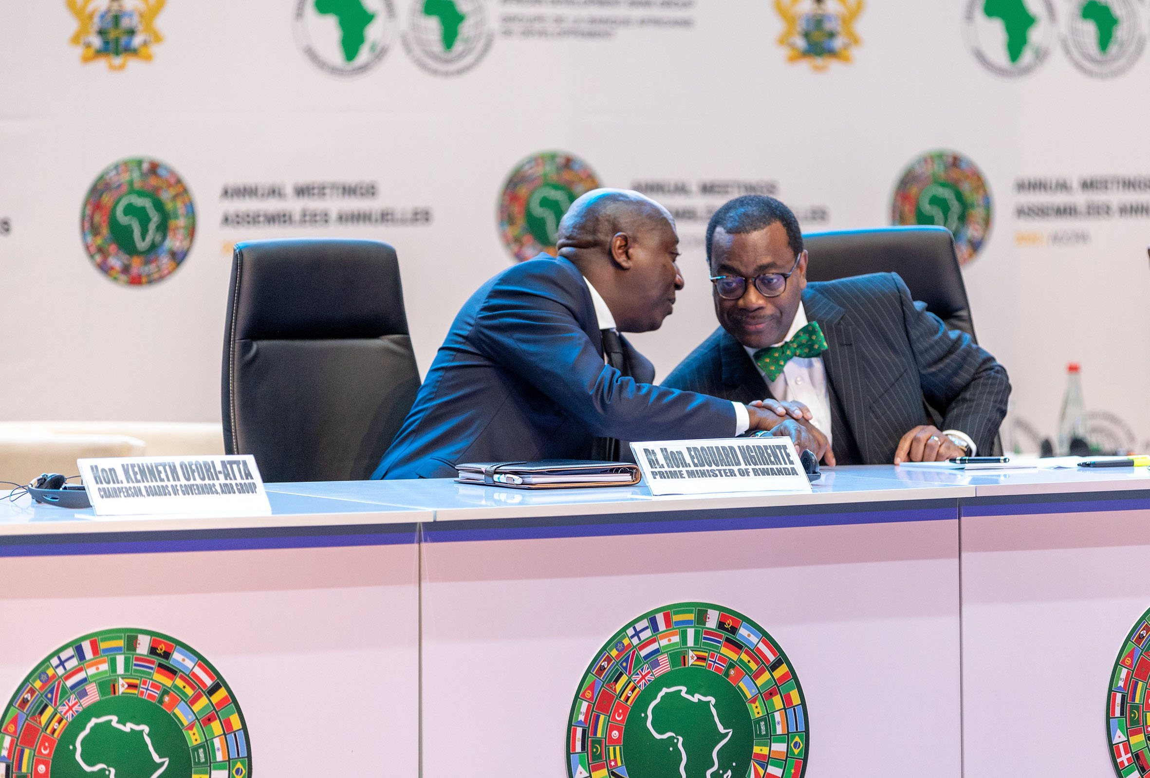 Prime Minister Edouard Ngirente consults with Dr Akinwumi A. Adesina, President of the African Development Bank, during the banku2019s annual meeting in Accra, Ghana on Tuesday, May 24. The premier said that the governmentu2019s investments in rural areas were part of the drivers of rapid economic recovery from the Covid-19 effect. / Photo: Courtesy.  