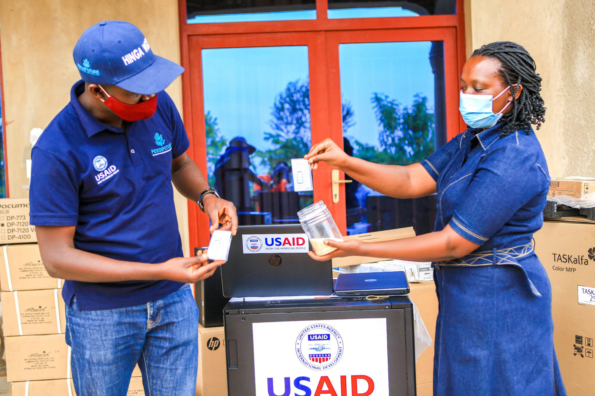 USAID-Hingaweze project staff showcase drycard devices that will be distributed across the country. Farmers are being trained to use the drycards to help them fight Aflatoxin so as to reduce post-harvest losses. Photo: Courtesy.