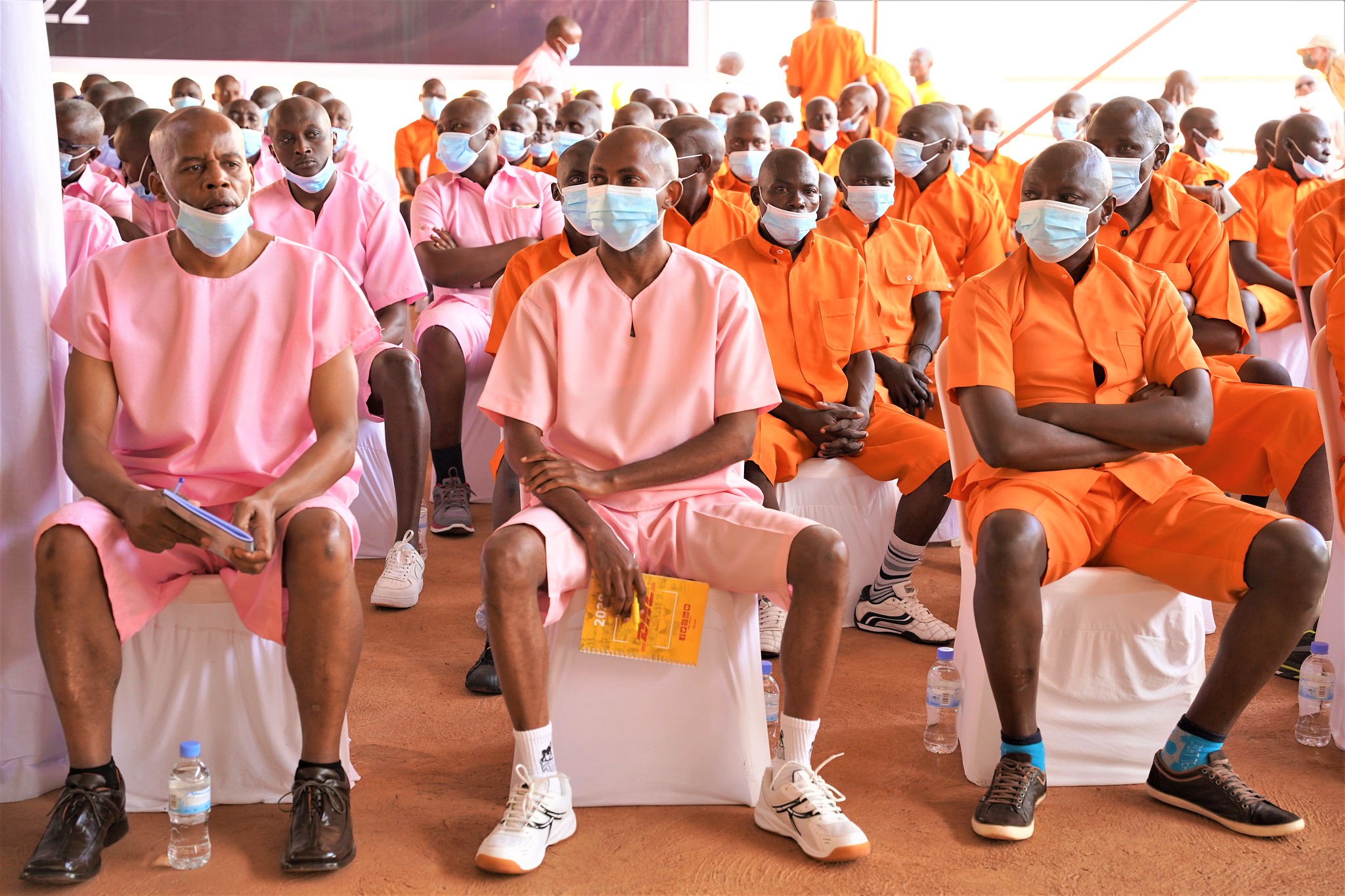 Callixte Nsabimana Sankara (c) with other inmates follow different plays organized by their mates to sensitize the importance of having a TVET school at the prison 
