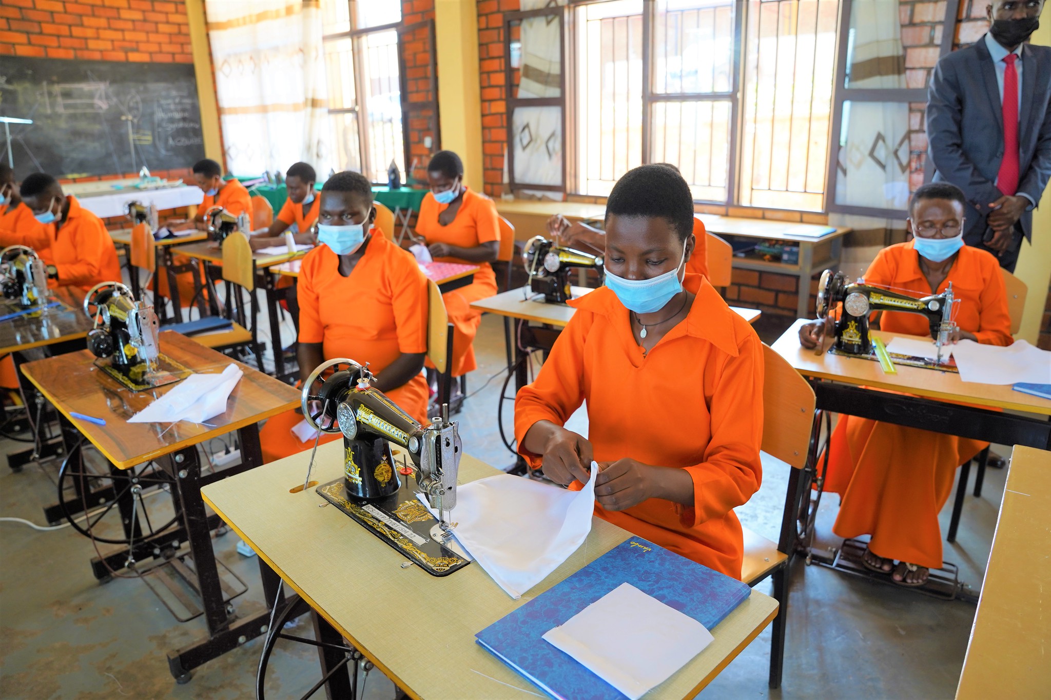 A class of inmates who study tailoring during their practices on May 26