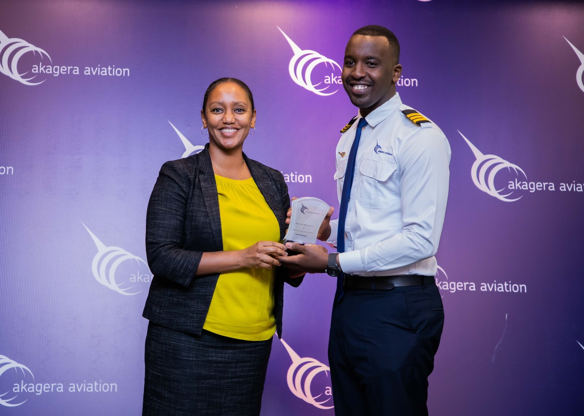 CEO RwandaAir Yvonne Makolo awarding Fabien Musonera the best Check Ride Performer during the ceremony on May 27.Courtesy