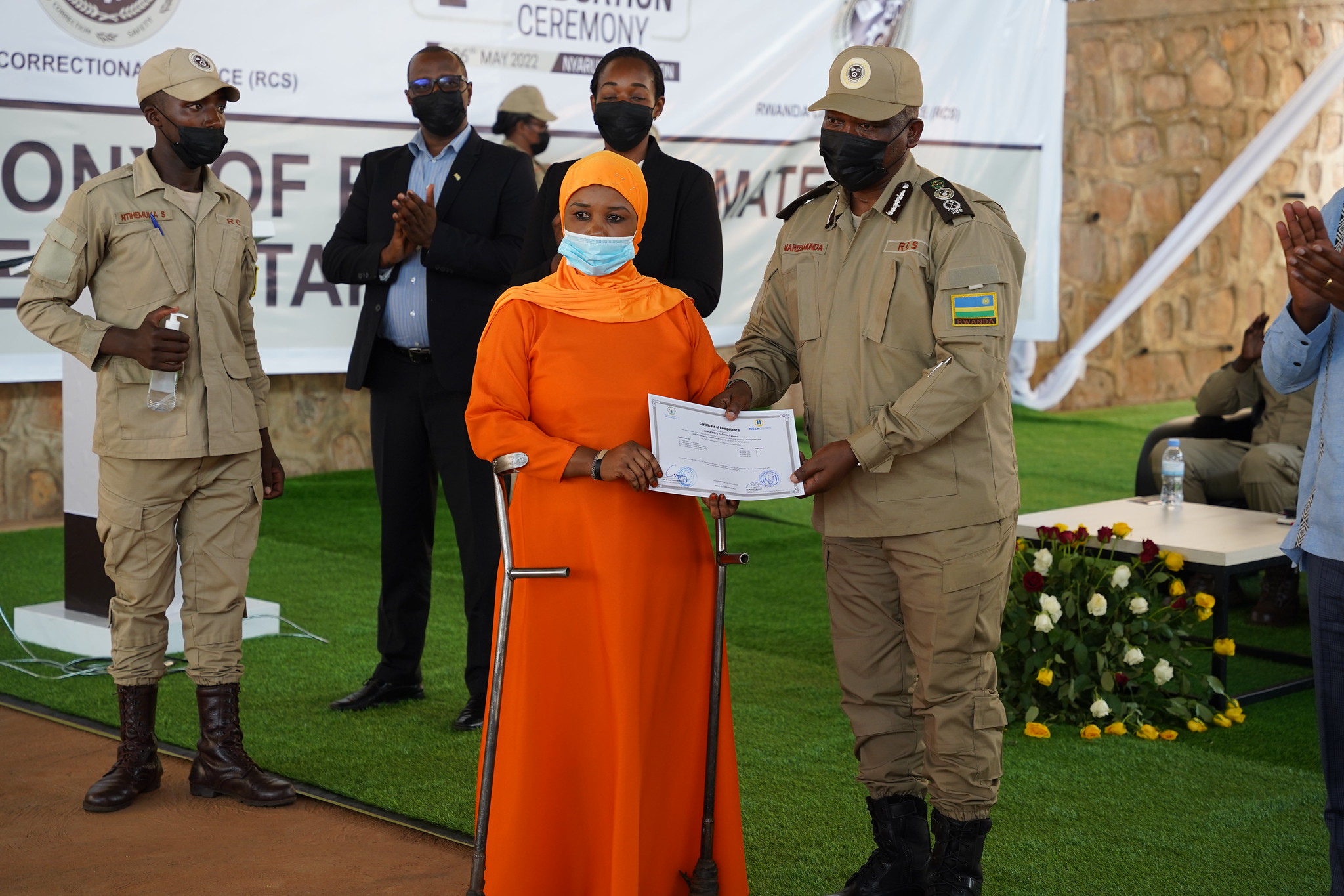 One of inmates trainees who graduated at RCS TVET Center at Mageragere on May 26. Seen here receives her certificate during the graduation ceremony. All Photos by Craish Bahizi One of inmates trainees who graduated at RCS TVET Center at Mageragere on May 26. Seen here receives her certificate during the graduation ceremony. All Photos by Craish Bahizi