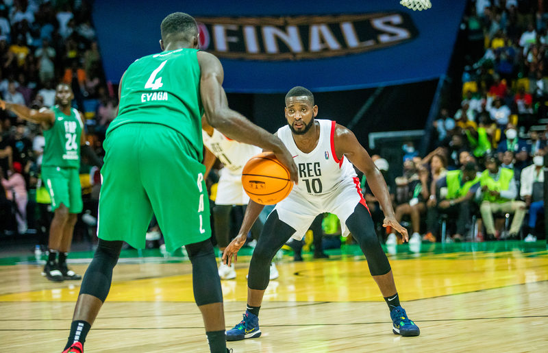 REG center Olivier Shyaka (#10) plays defence against FAP player Brice Bidias during their quarter-final game at BK Arena on Saturday, May 21, in Kigali. Photo: Olivier Mugwiza.