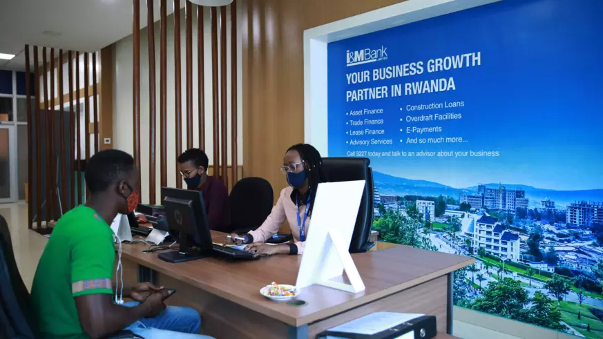 I&M Bank client interacts with information desk personnel at Kigali Heights branch. 