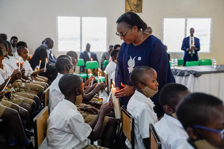 Minister for Education Valentine Uwamariya helps students to light candles during a commemoration event of over 8,000 Tutsi who were killed at Petit Su00e9minaire Saint Vincent de Ndera during the 1994 Genocide against the Tutsi, in Gasabo District on May 28. 