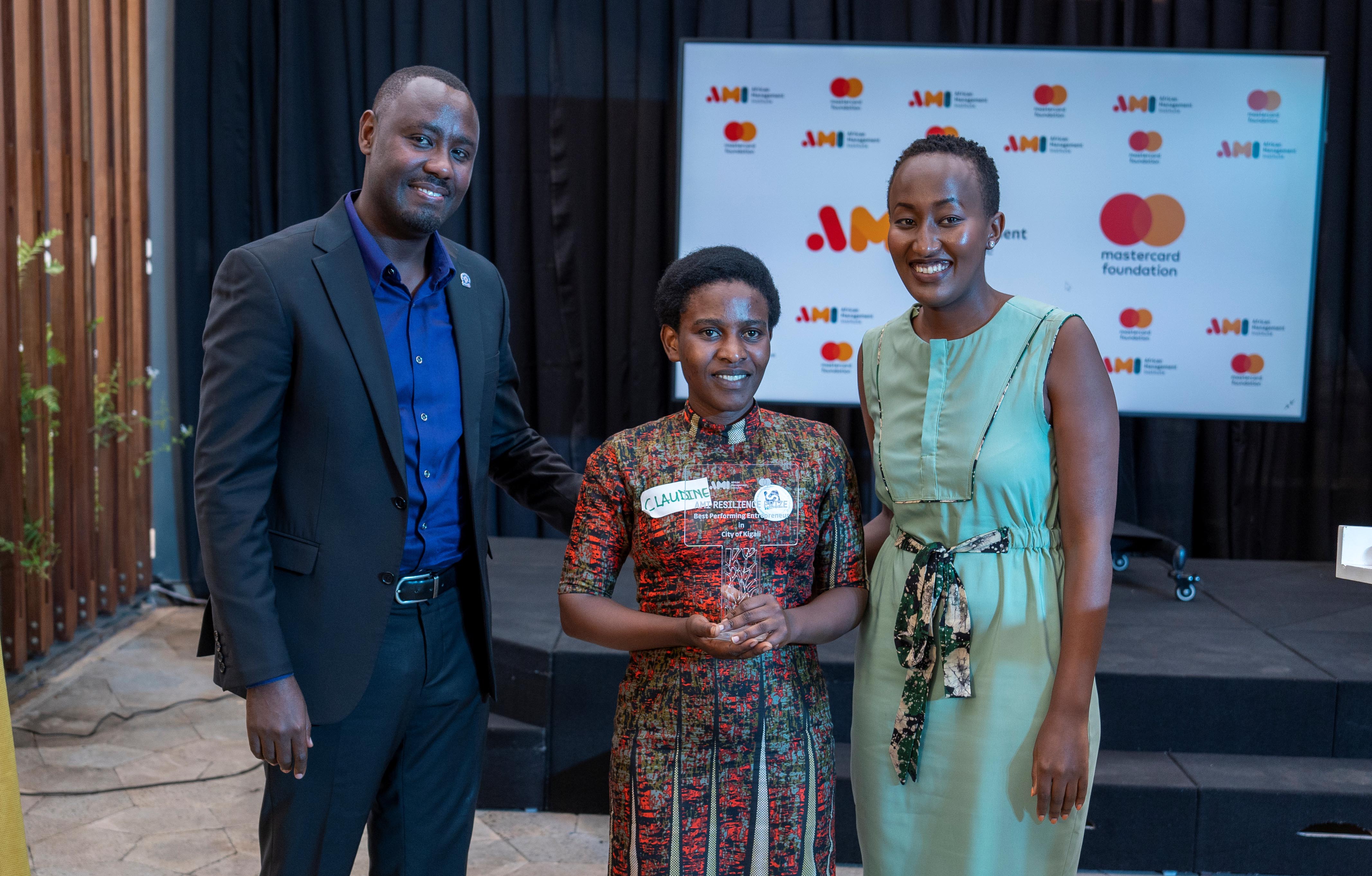 Livingstone Nkuusi the Program Lead, MSME Finance - MasterCard Foundation, Claudine Niyonzima, owner of San Tech and Best performing entrepreneur in Kigali City and Allen Ingabire, Partnership Manager at AMI.jpg