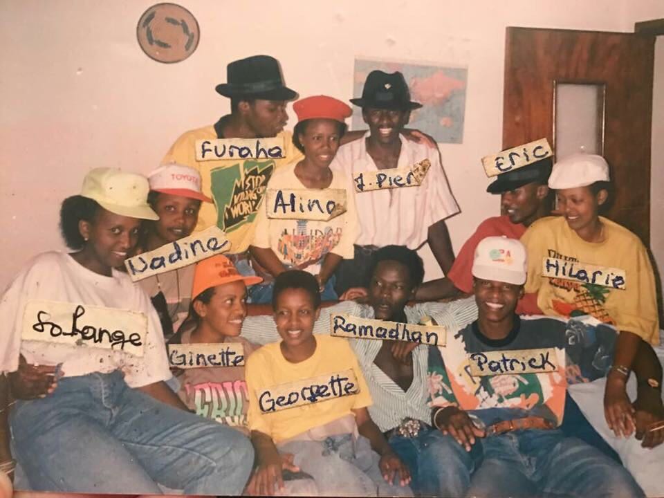 A group photo of Solange Karenzi and her friends in her father's home library.