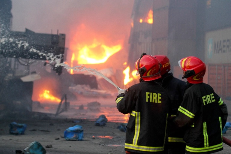 Firefighters try to extinguish a fire that broke out at a container storage facility in Sitakunda, about 40km (25 miles) from the key port of Chittagong. 