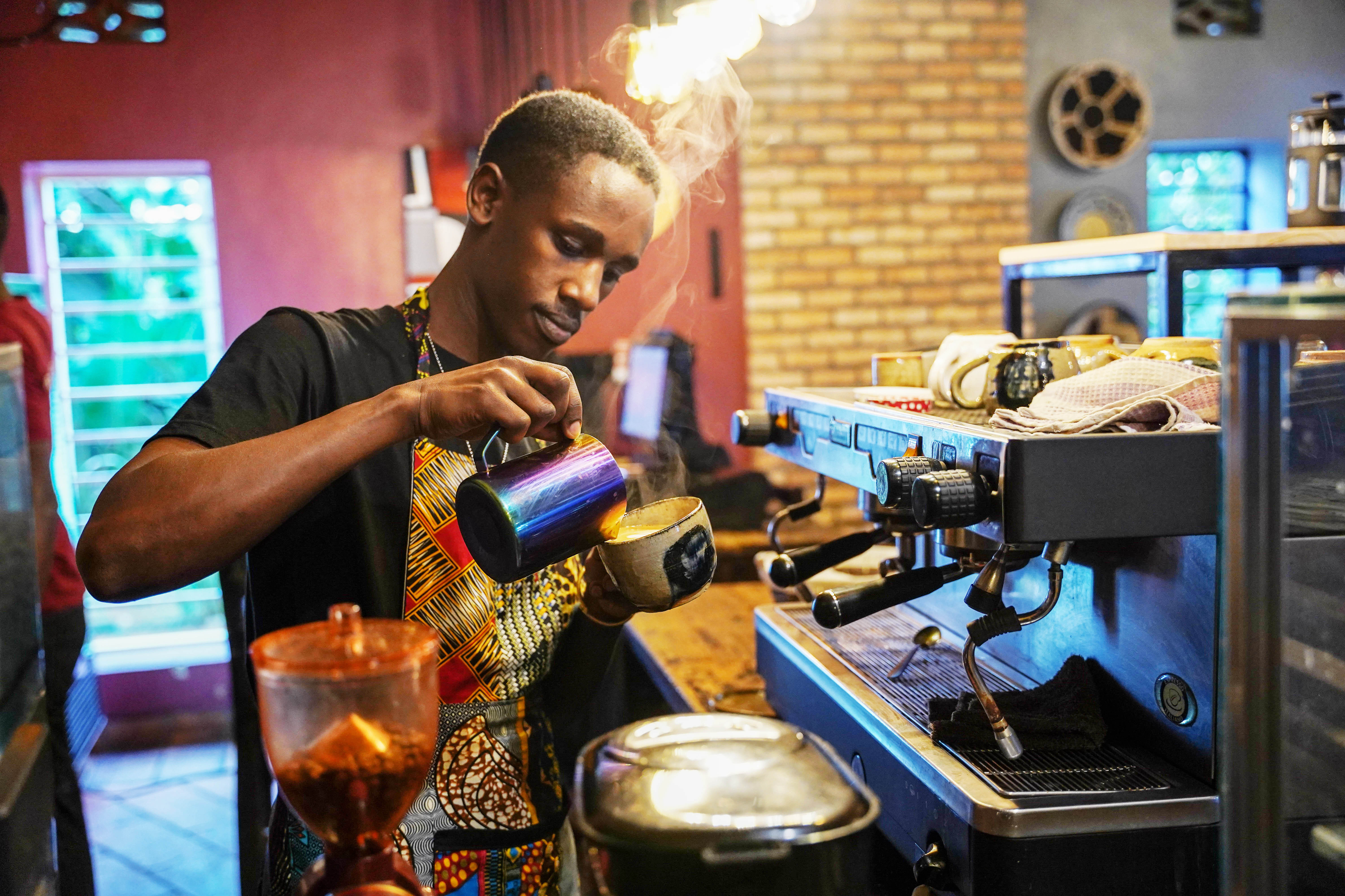 Herve Gatabazi, a 26-year-old barista in one of Kigaliu2019s finest coffee shops, KG Craft Cafu00e9. 