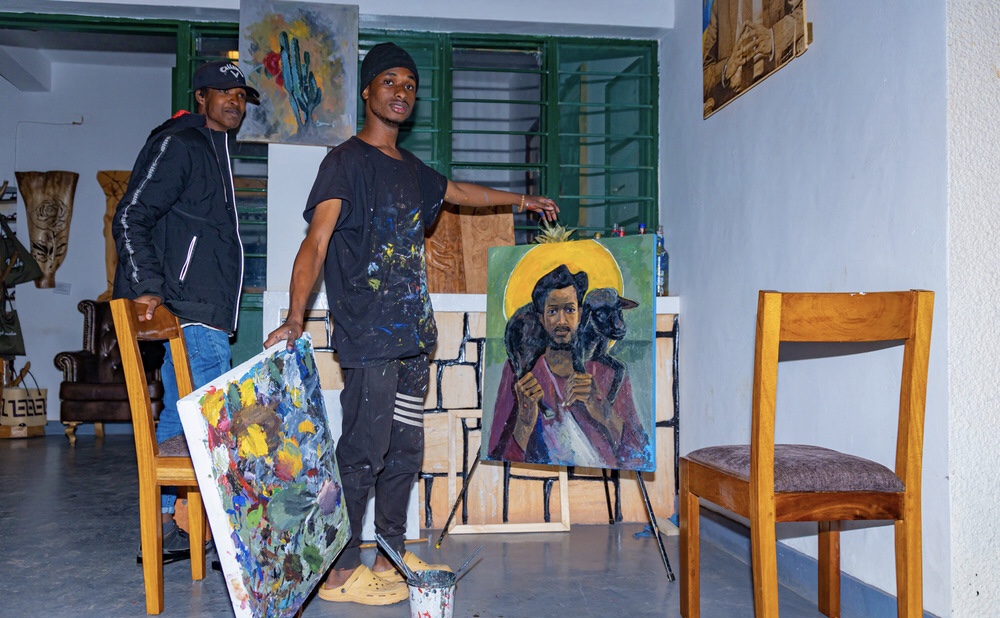 One of the artists displaying some of his art works at the exhibition.