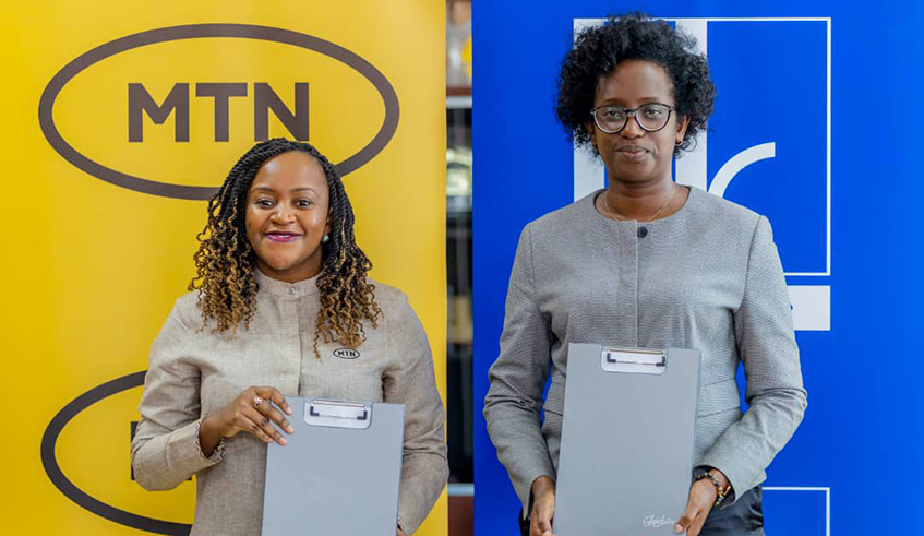 Mitwa Ng'ambi, the CEO of MTN Rwanda and  Diane Karusisi, Chief Executive Officer of BK PLC during the signing  ceremony in Kigali on June 7.Courtesy