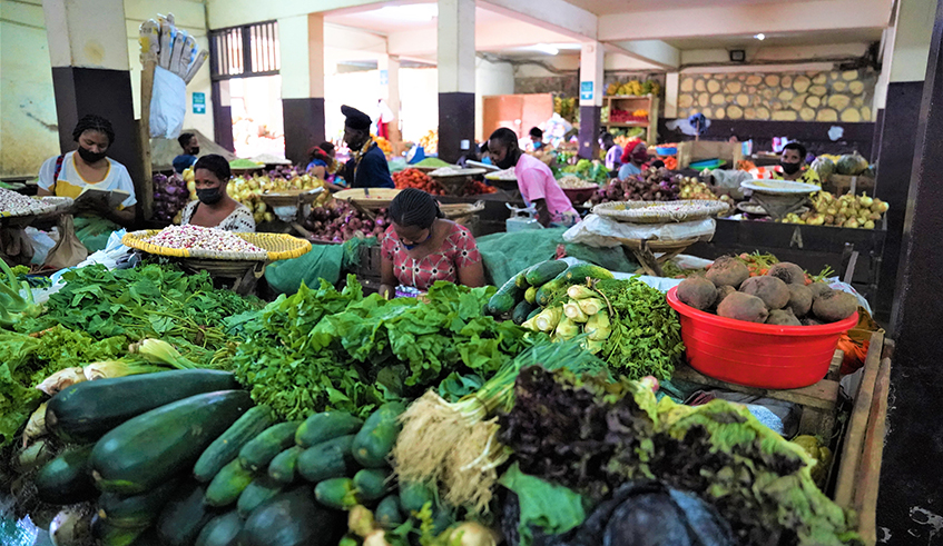 Sellers of vegetables wait for clients at Nyabugogo Market. Photo: Craish Bahizi.