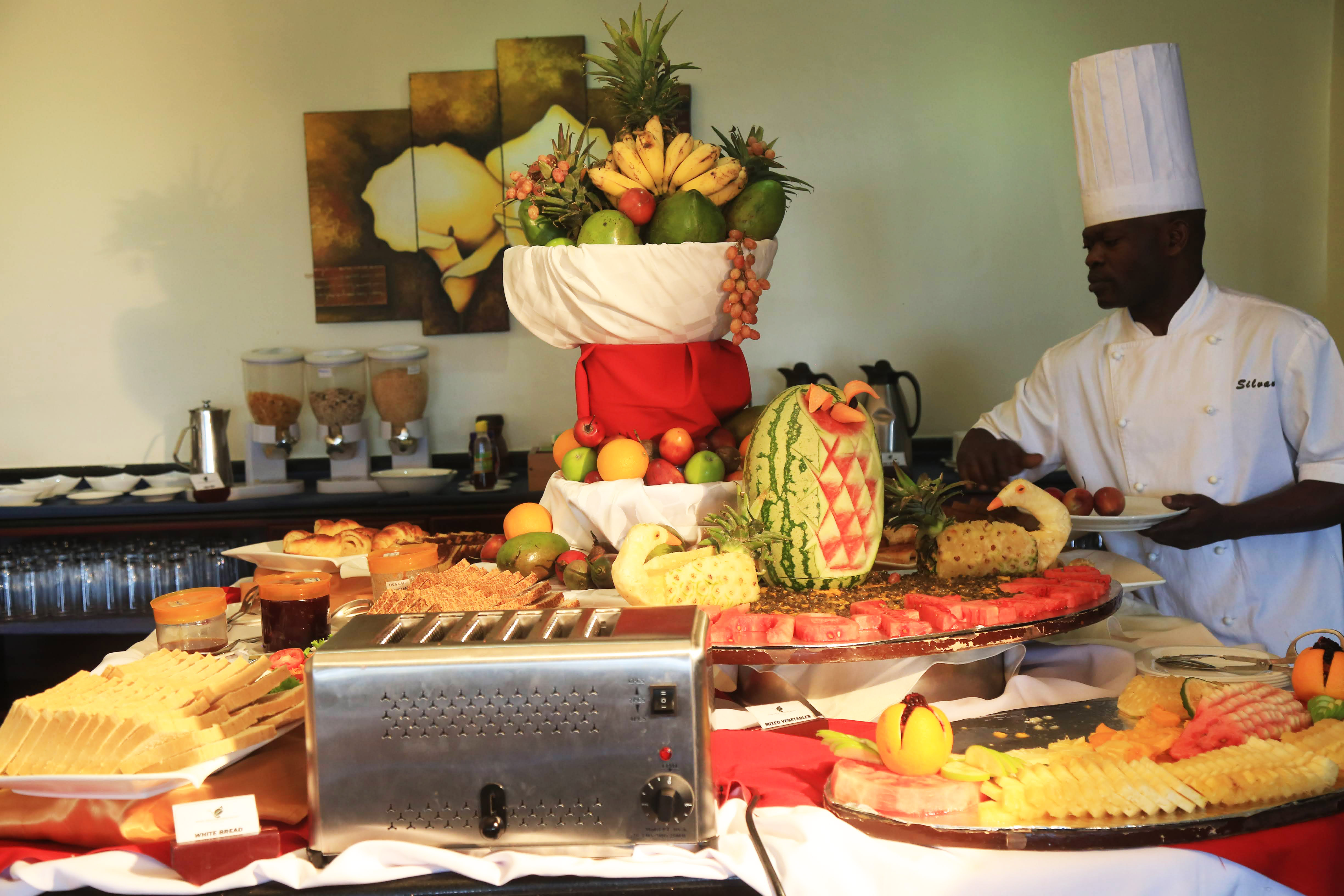 A chef arranges food stuff during the lunch time in Kigali. 