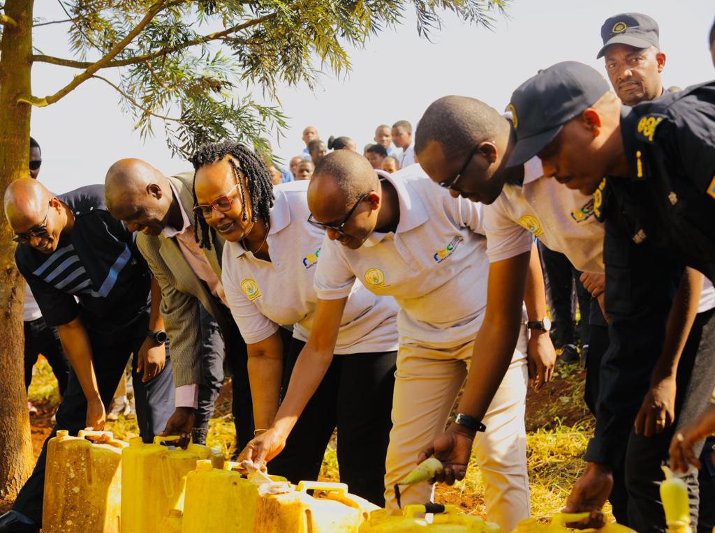 Dr. Tharcisse Mpunga, the State Minister in charge of Primary Healthcare with other officials destroy different drugs during a nationwide campaign against drug abuse among the youth, which took place in Kayonza Districta on Tuesday, June 7