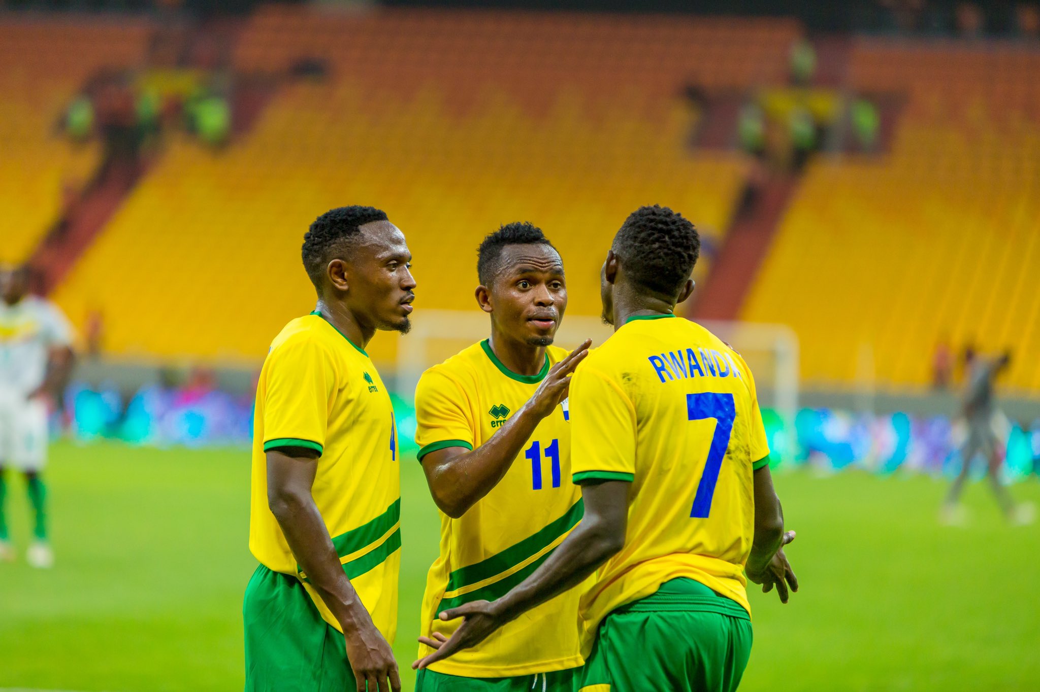 National football team midfielder Kevin Muhire (c) talks to his teammates during the match against Senegal on June 7 in Dakar.Amavubi head coach Carlos Ferrer has hailed the performance of his players despite losing 1-0. Photo: Courtesy.