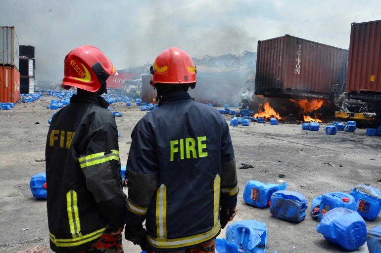 Firefighters working to put out the huge fire that broke out in an inland container depot at Sitakund, near the port city of Chittagong, Bangladesh. 
