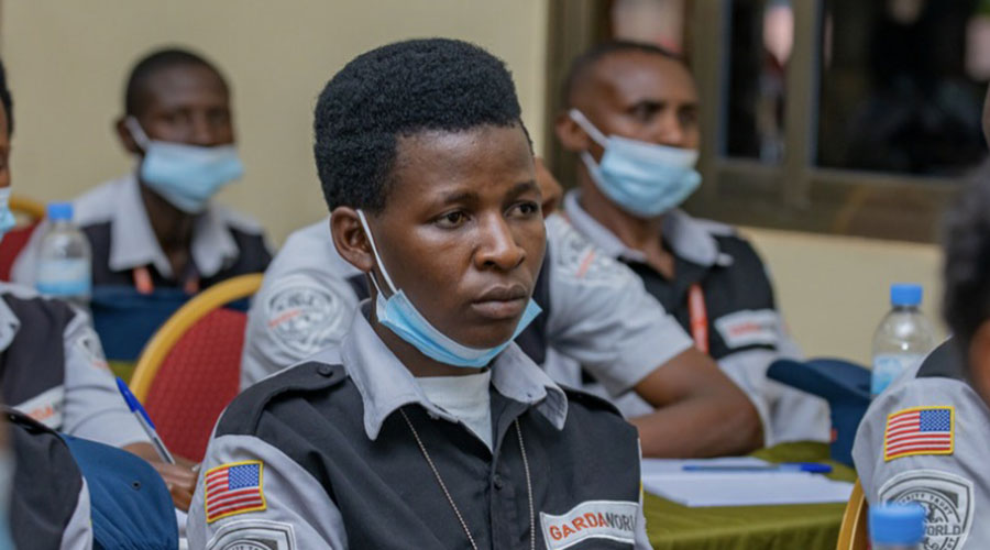 A female security guard pays attention during the training. 