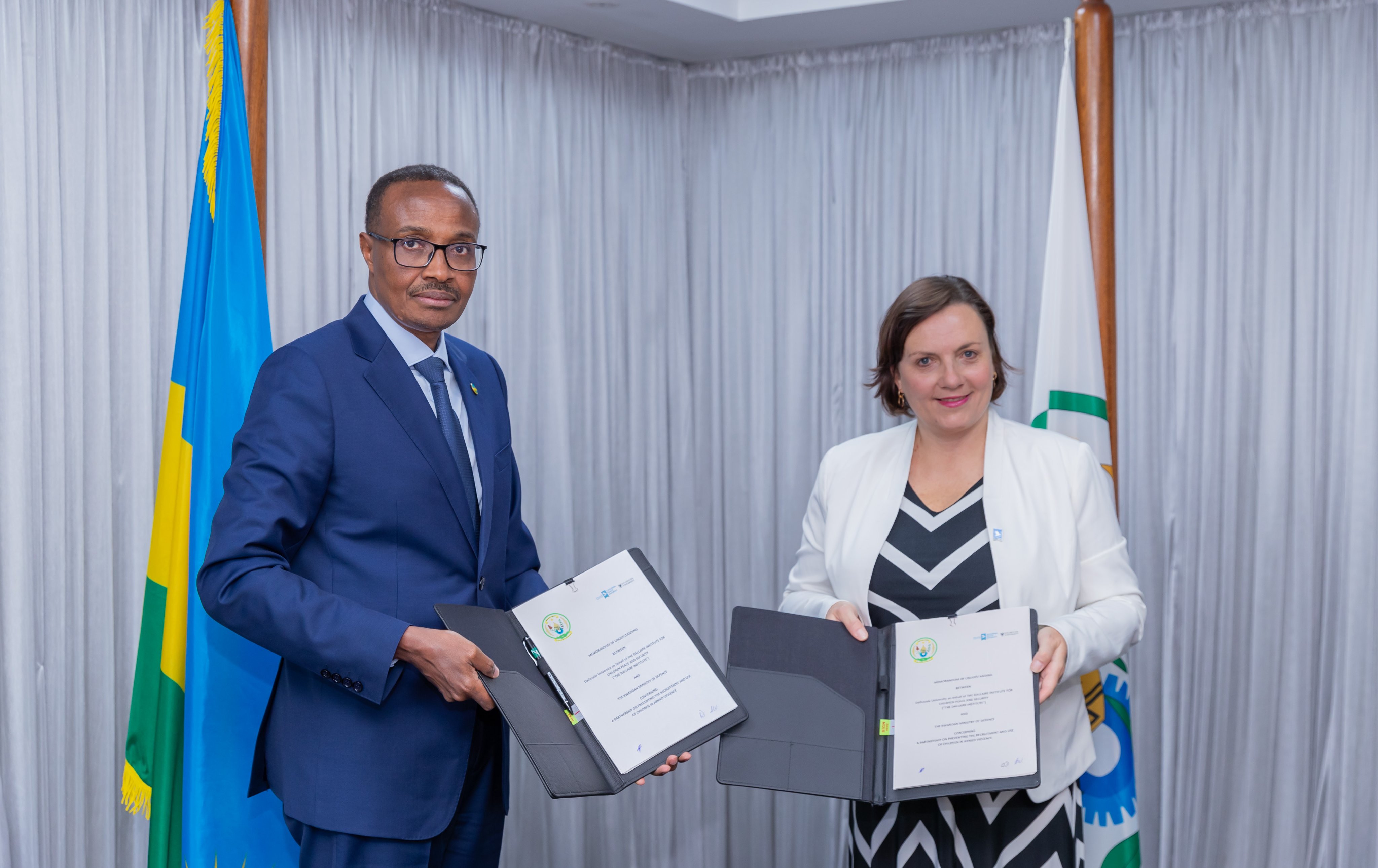 Minister of Defence, Maj Gen Albert Murasira and Shelly Whitman, the Executive Director of the Dallaire Institute for Children, Peace and Security during the signing ceremony in Kigali on June 13.Courtesy