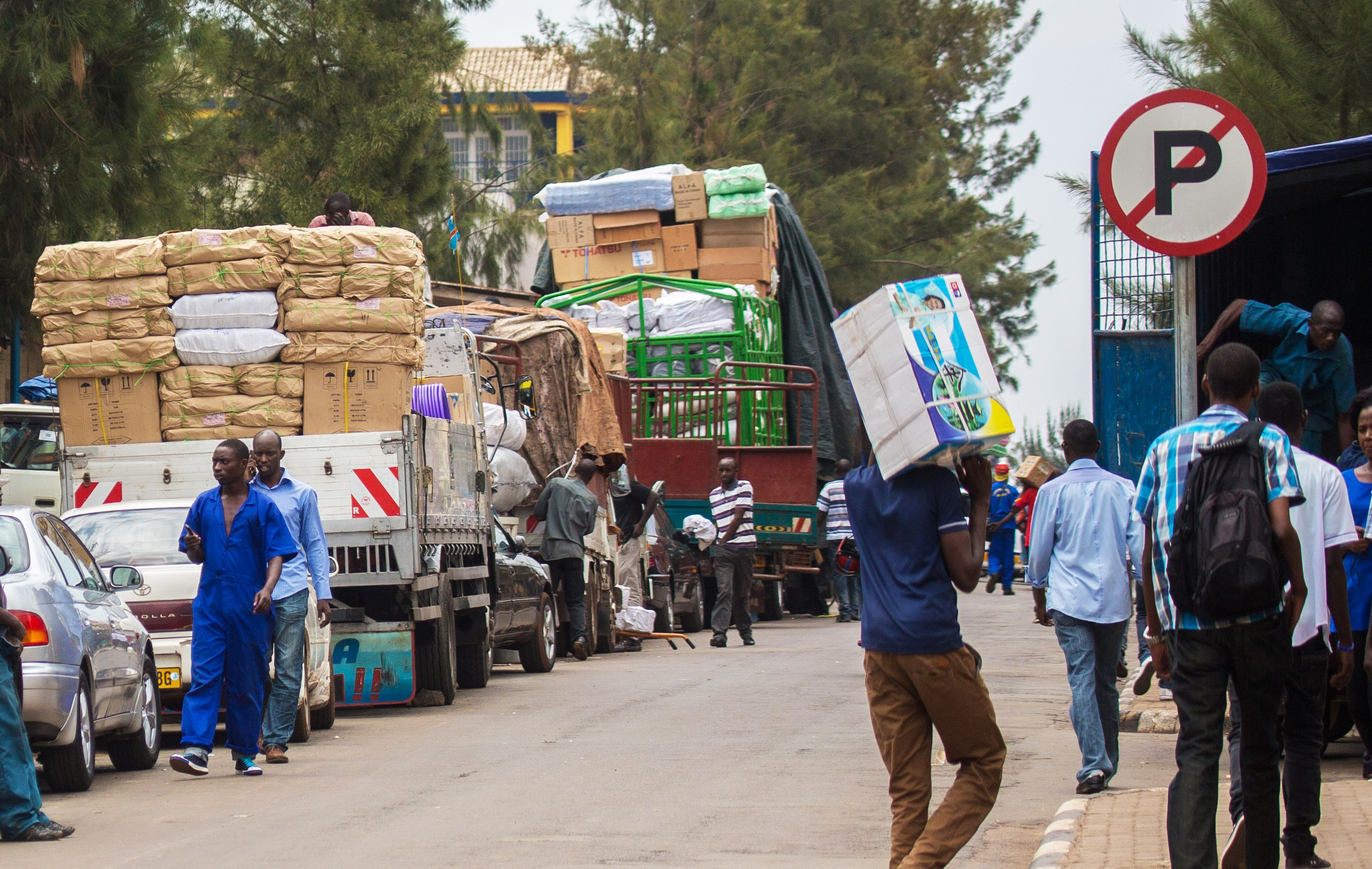 Workers load different commodities at Kigali City's business district  for upcountry supply.Rwanda will start implementing a 35% tax rate on products that are imported from outside East Africa yet are manufactured in EAC. / file
