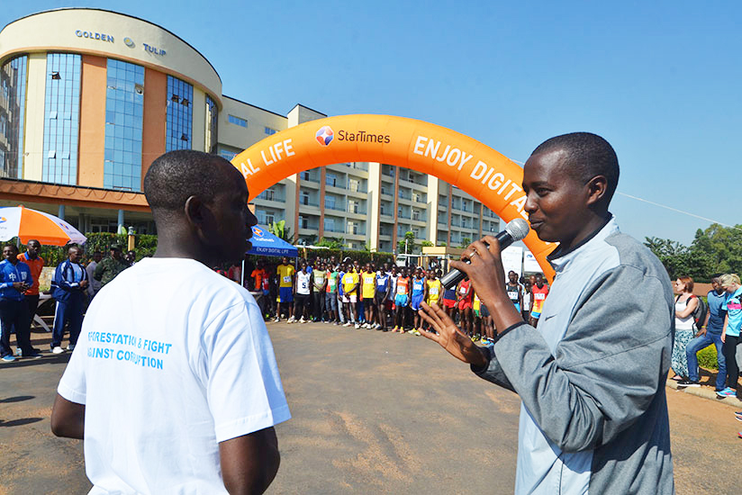 Serge Gasore, the organizer of the race, gives his remarks as the athletes get ready to start the Bugesera 20 Km race in 2017. 