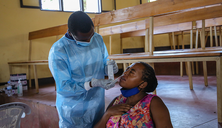 A health worker conducts Covid 19 test in Kigali on July 23, 2021. Photo: Craish Bahizi.