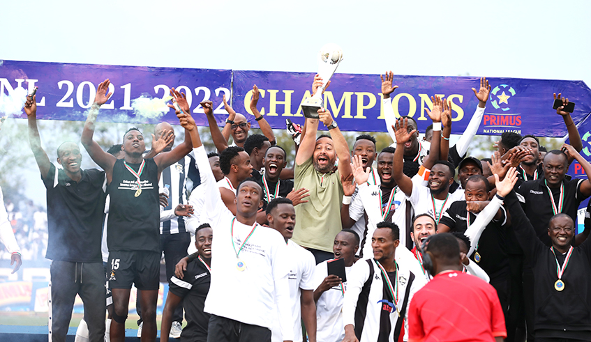 APR FC head coach Mohamed Adil Errade  and players celebrate the victory after winning the league title last week. Photo: Sam Ngendahimana.